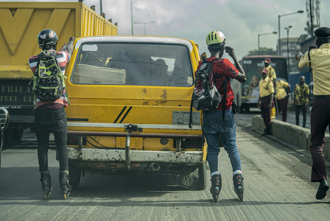 Commuters and traffic officers on a busy Lagos road
